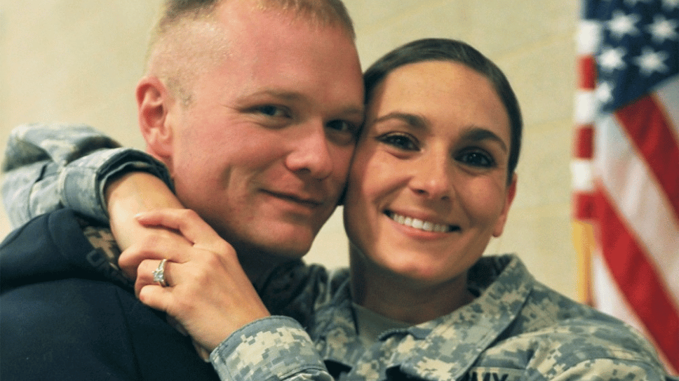 Veteran wife hugging significant other.