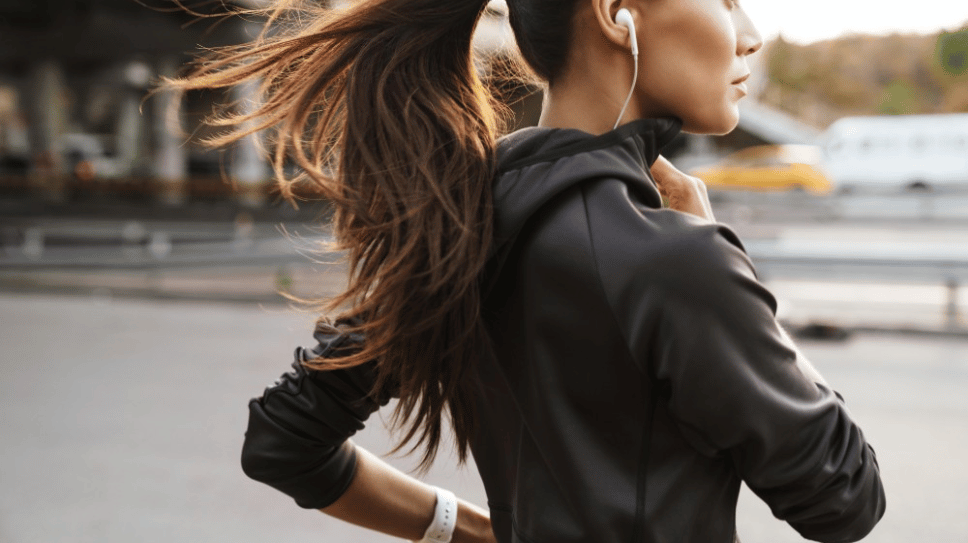 Woman running in a jacket