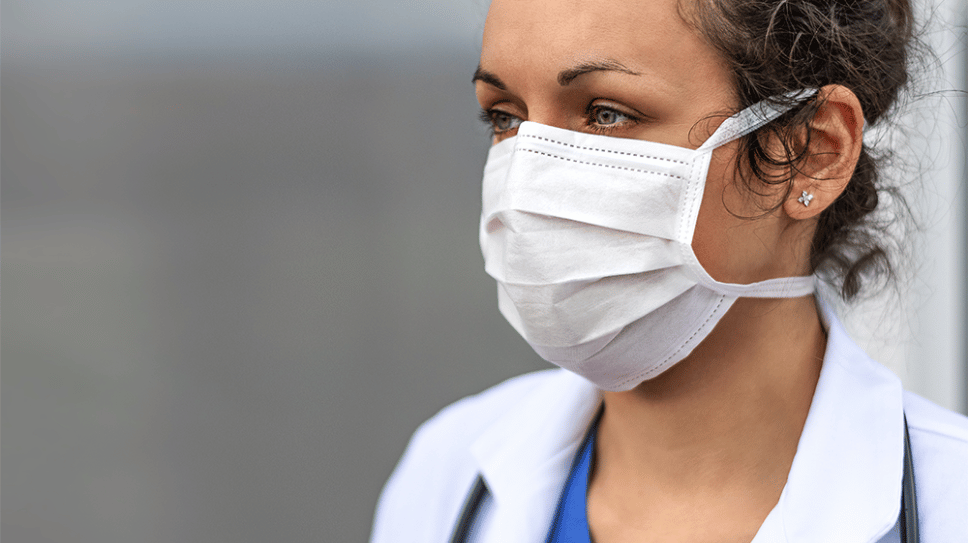 Female healthcare worker wearing face mask