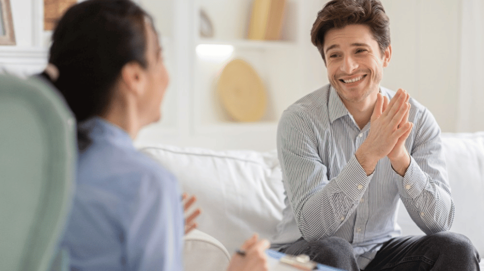 Young man looking happy in therapist office